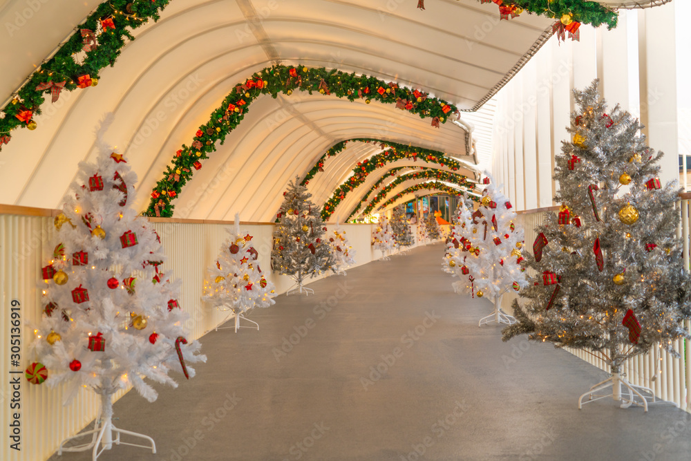 Christmas tree decoration along walkway in city center in Christmas festival of December 2019.