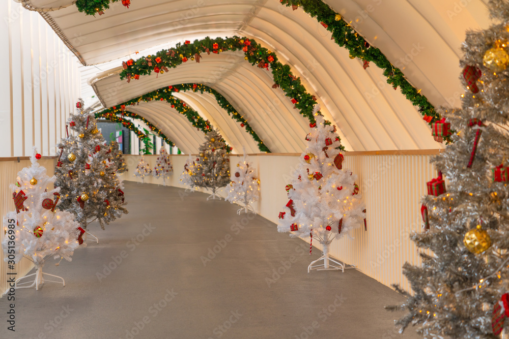 Christmas tree decoration along walkway in city center in Christmas festival of December 2019.