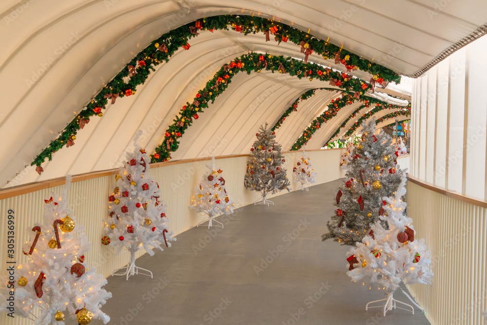 Christmas tree decoration along walkway in city center in Christmas festival of December 2019.