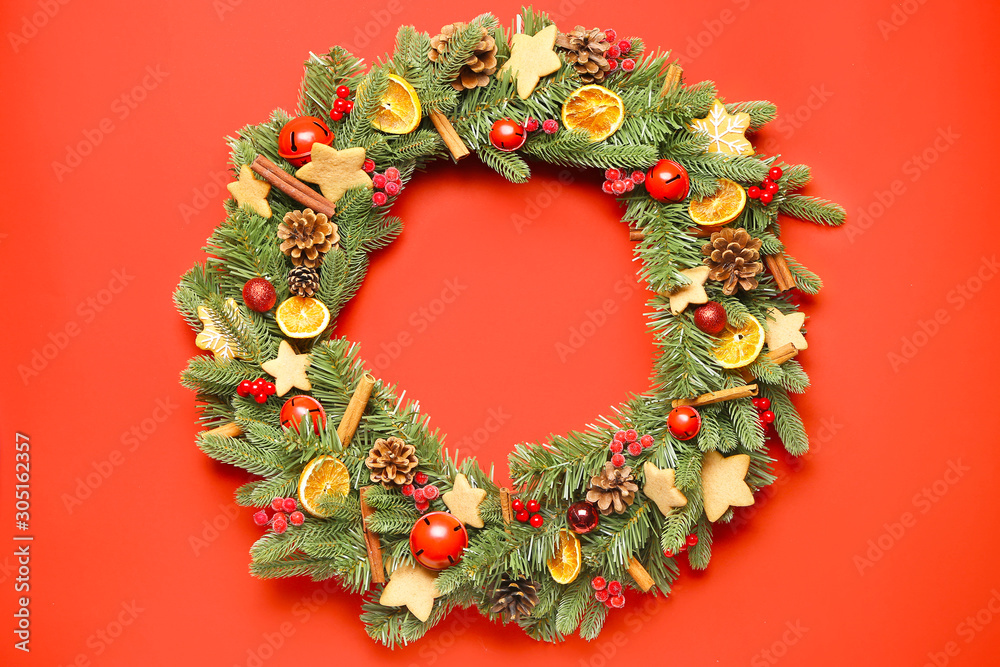 Beautiful Christmas wreath on color background