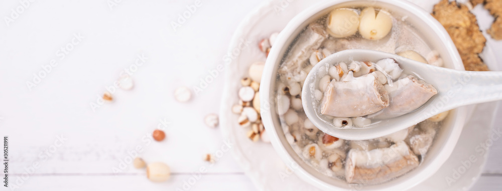 Tasty Four Tonics Herb Flavor Soup, Taiwanese traditional food with herbs, pork intestines on white 