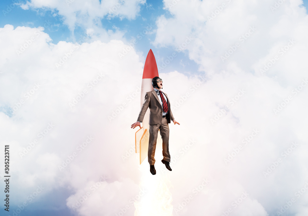 Business person in aviator hat flying on rocket