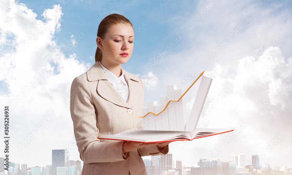 Businesswoman with growing financial graph