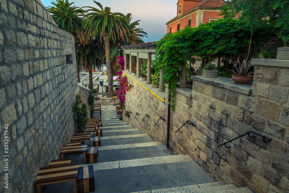 Narrow street and street cafe at morning, Hvar, Dalmatia, Croatia