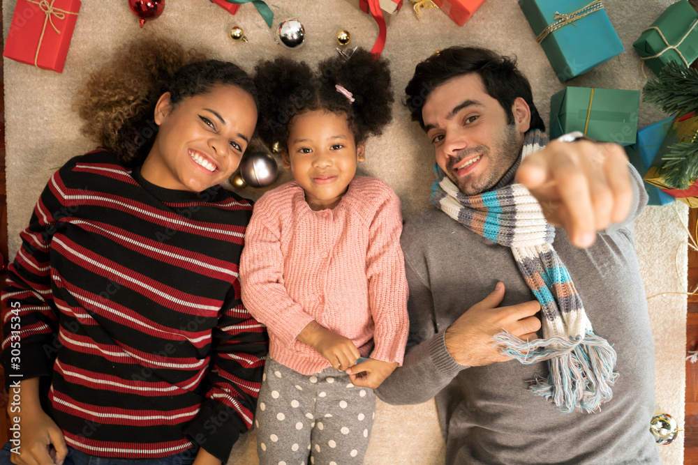 Portrait of Family exchange gifts on Christmas.