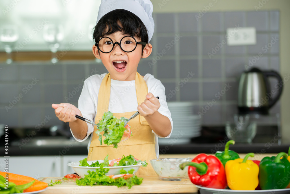 cute boy  preparing fresh salad