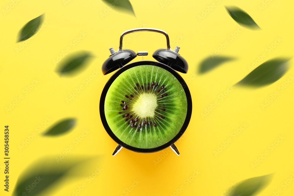 Alarm clock on color background