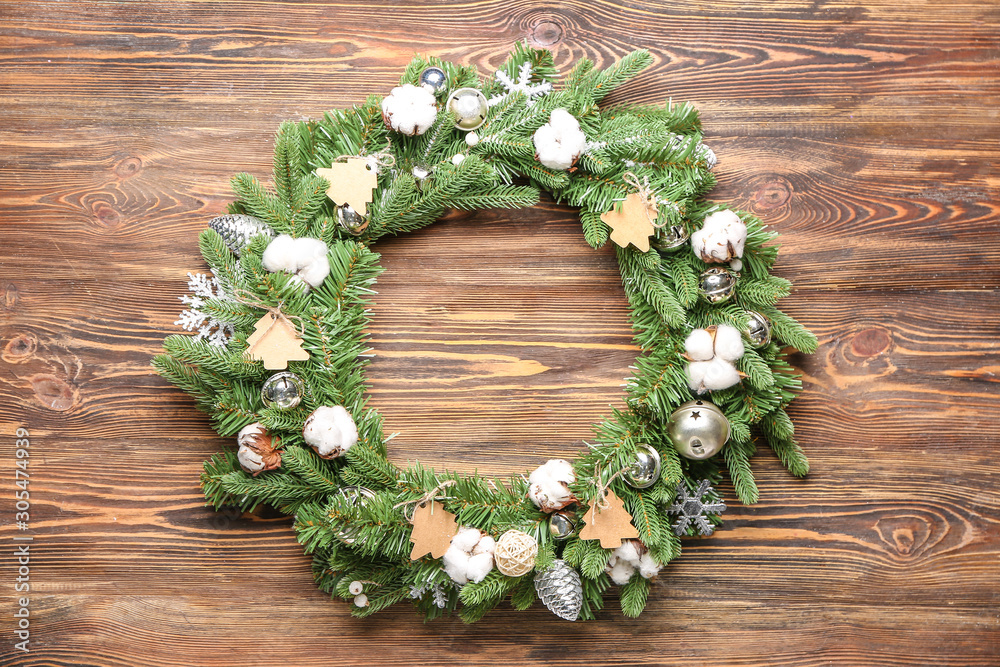 Beautiful Christmas wreath on wooden background