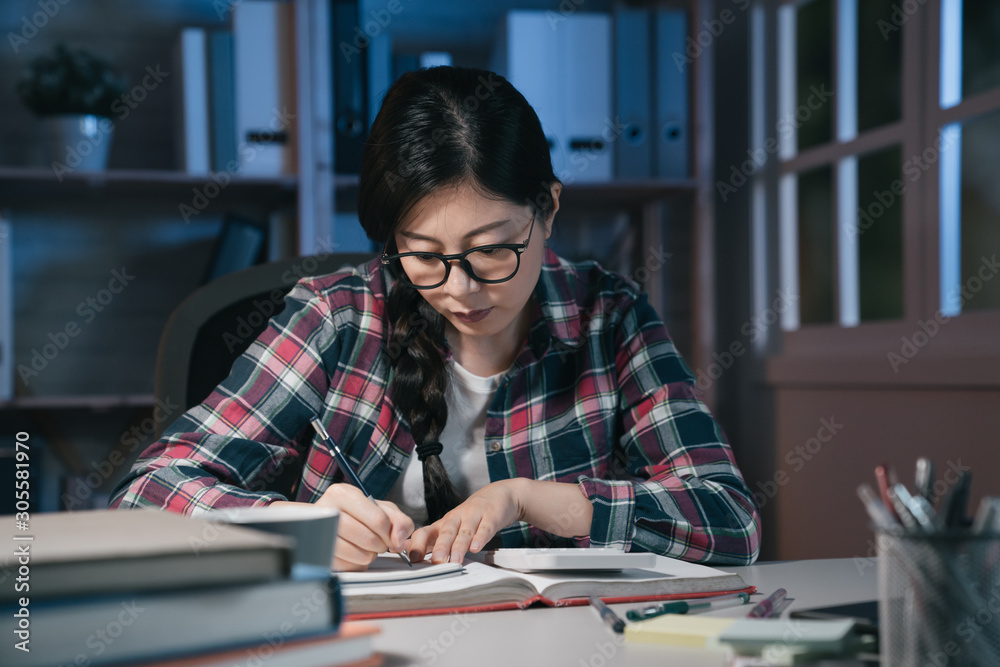 asian japanese female teenage student reading books and studying late at night in dark place in apar