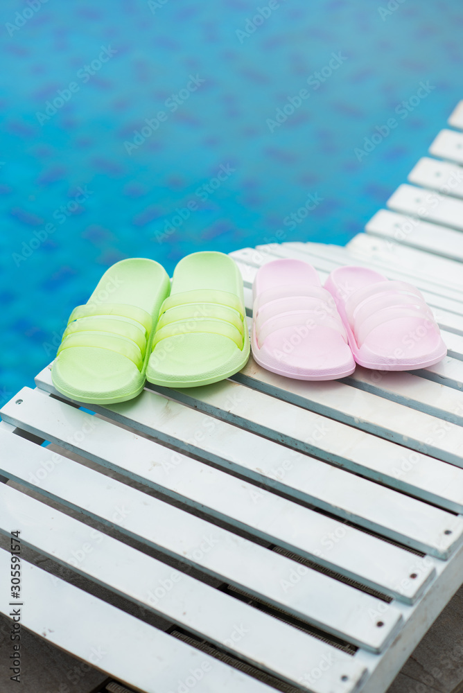 Cute sandal by the swimming pool in the resort