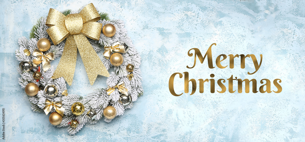 Beautiful wreath and text MERRY CHRISTMAS on color background