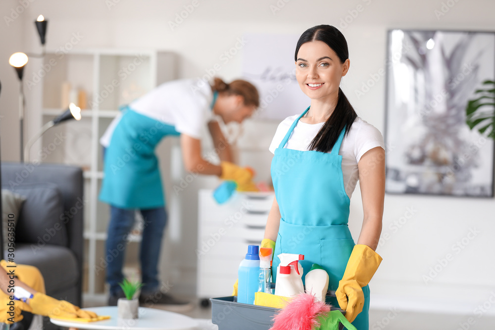 Team of janitors cleaning flat