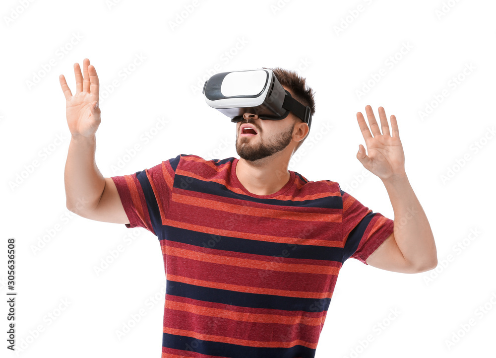 Young man with virtual reality glasses on white background