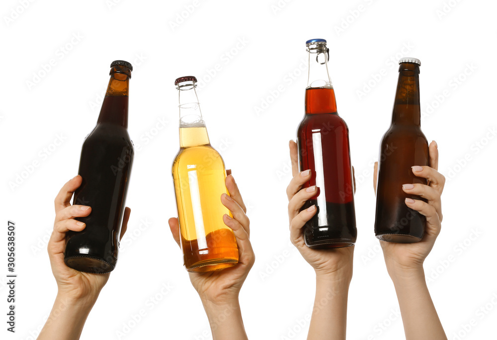 Hands with bottles of beer on white background