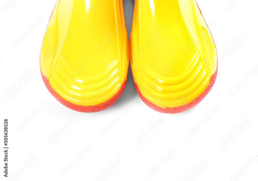 Stylish gumboots on white background