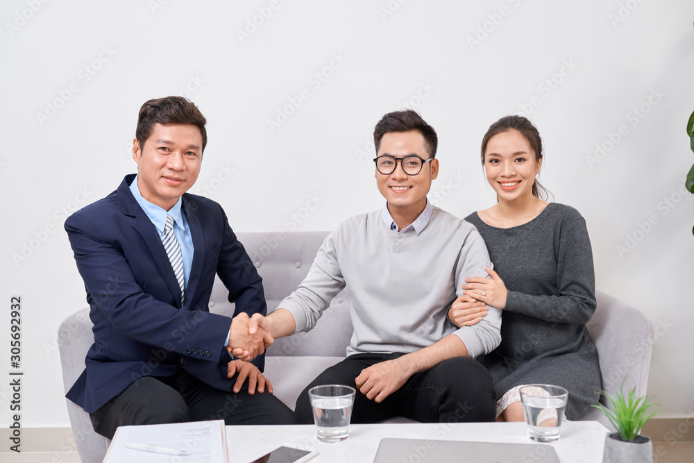 Real estate agent working with clients in office