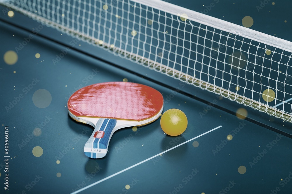 Table Tennis Rackets and Ball on Table with Net