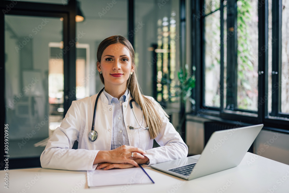 Portrait of a confident doctor at work in medical office.