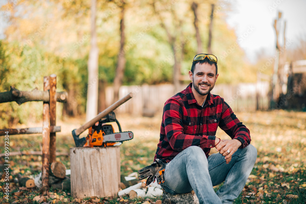 Outdoor portrait of a young countryman on autumn day.