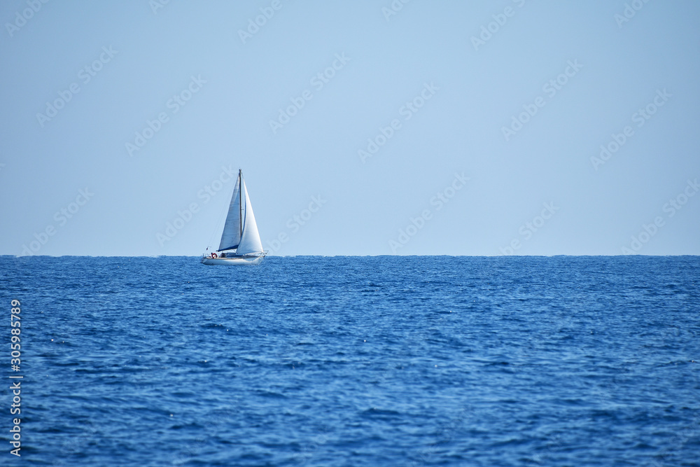 Seascape with water ripples and clear blue sky