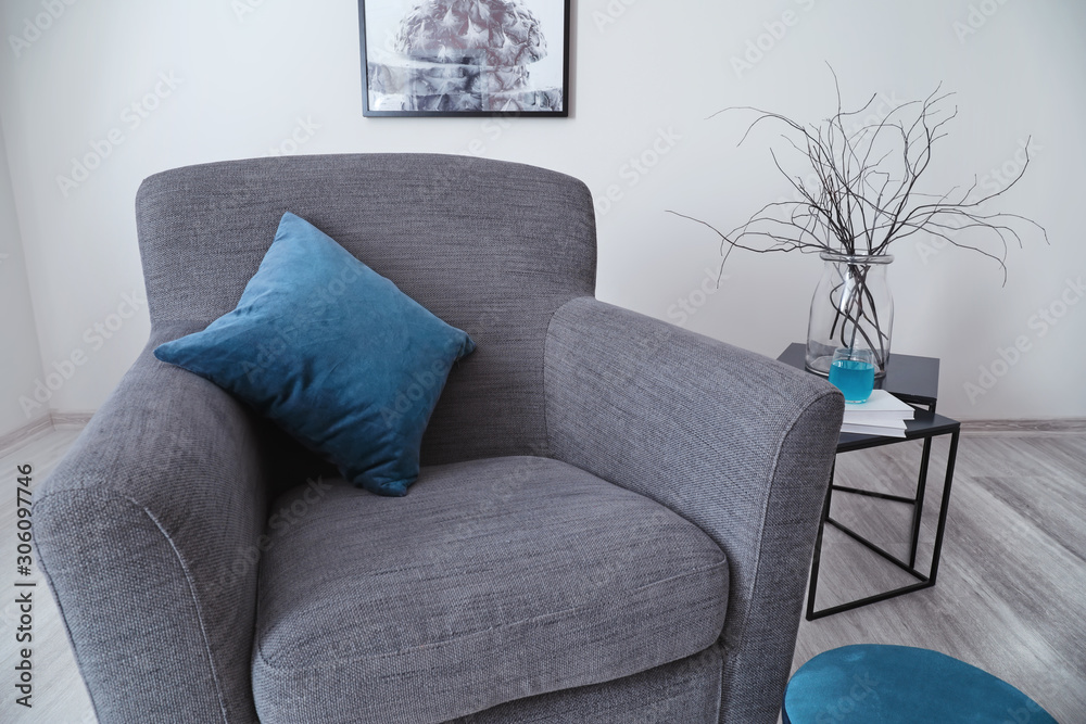 Comfortable armchair in interior of living room