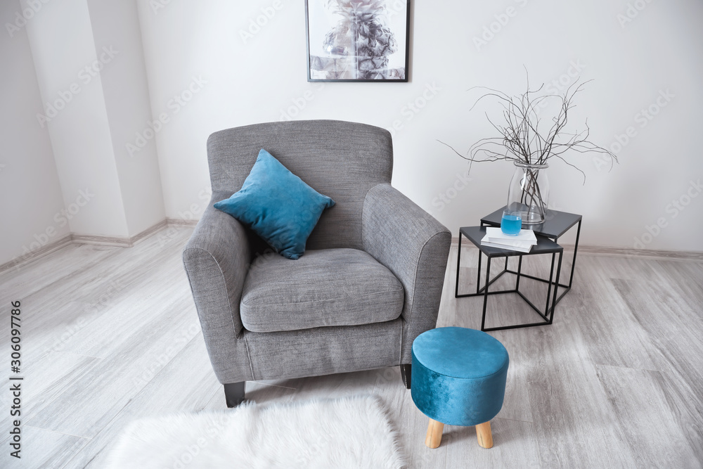 Comfortable armchair in interior of living room