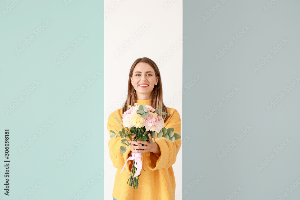 Beautiful young woman with bouquet of carnation flowers on color background