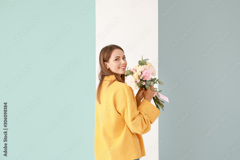 Beautiful young woman with bouquet of carnation flowers on color background