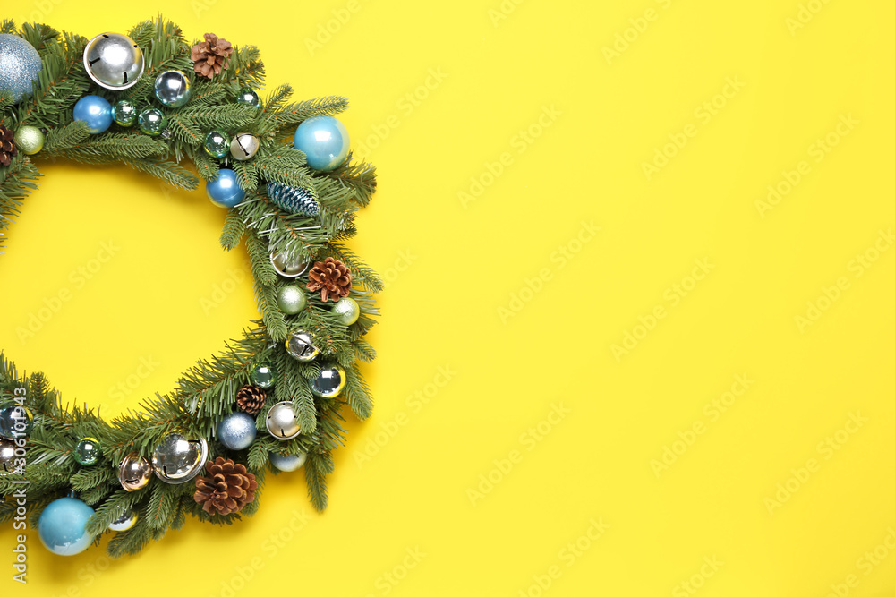 Beautiful Christmas wreath on color background