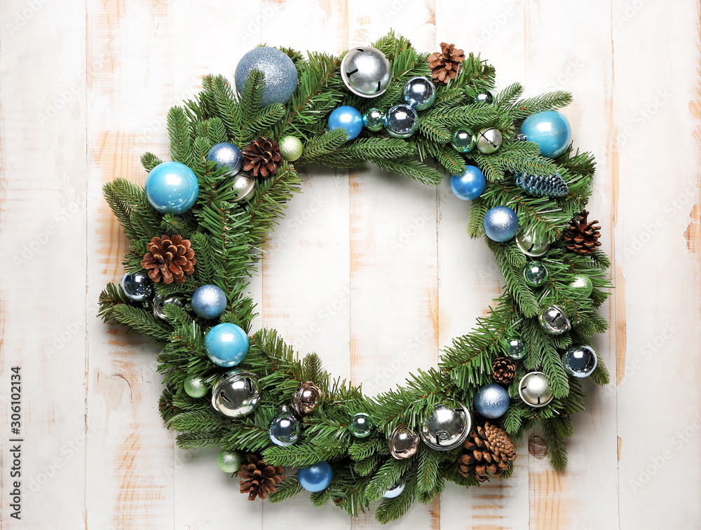 Beautiful Christmas wreath on white wooden background