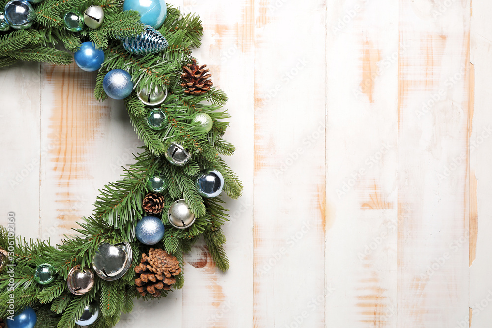 Beautiful Christmas wreath on white wooden background