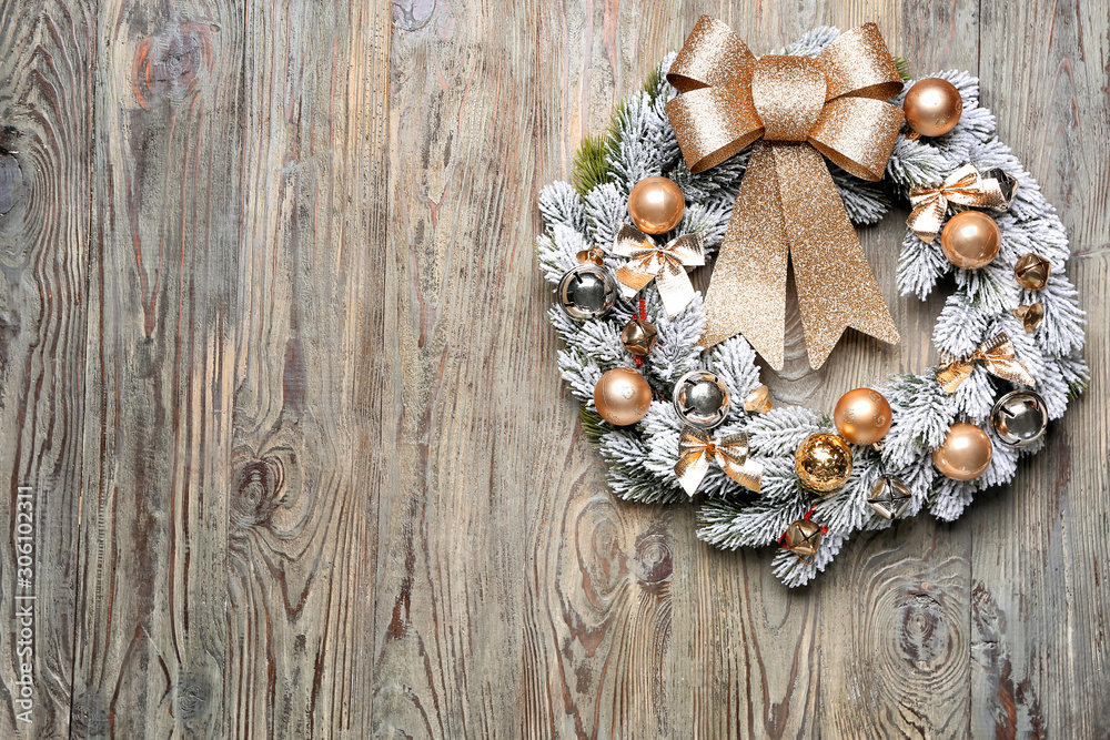 Beautiful Christmas wreath on wooden background