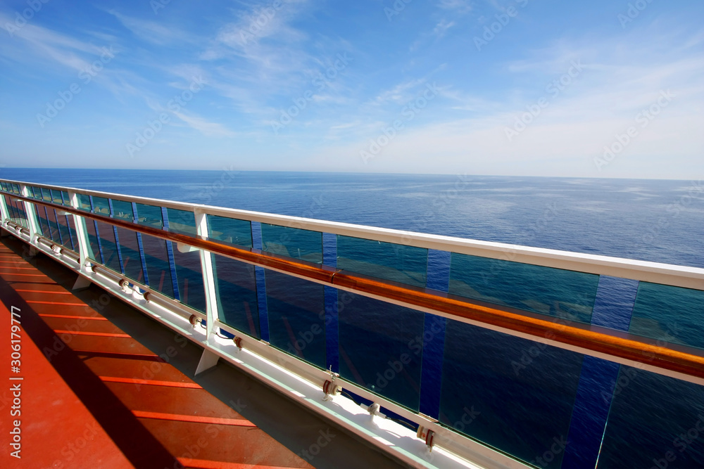 Empty promenade deck with hndrail on a cruise ship. 