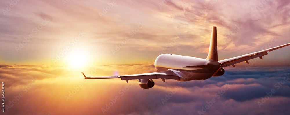 Passengers commercial airplane flying above clouds