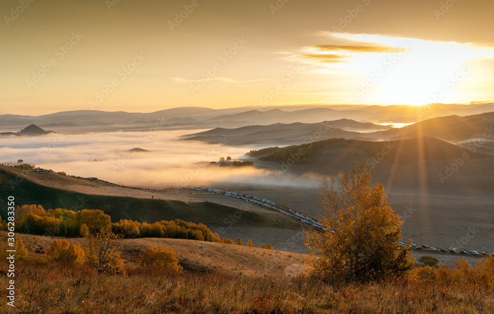 Early morning grassland and mountains