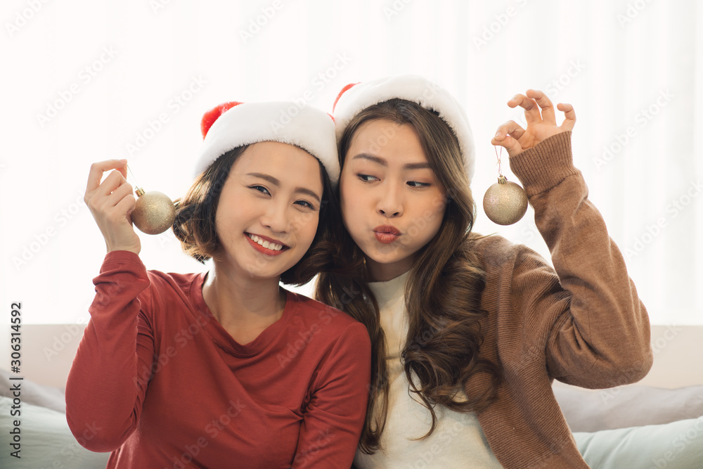 Asia lover Girlfriend hugging and give Christmas gift at xmas party