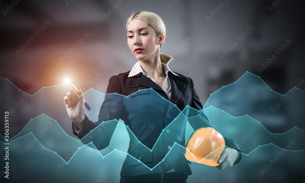 Businesswoman pointing on 3d financial chart