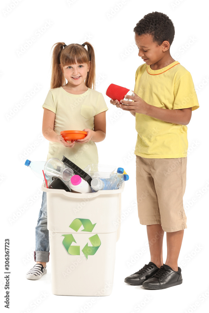 Little children and container with trash on white background. Concept of recycling