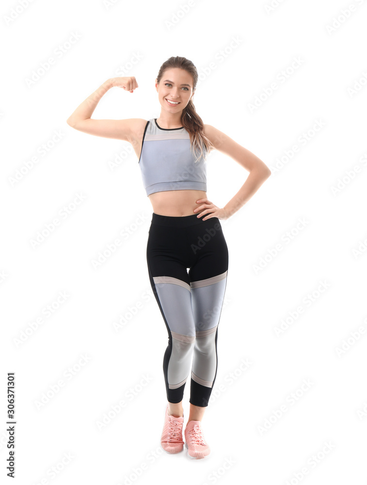 Sporty young woman on white background