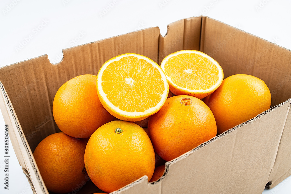 Navel orange in a box of fresh fruits on white background