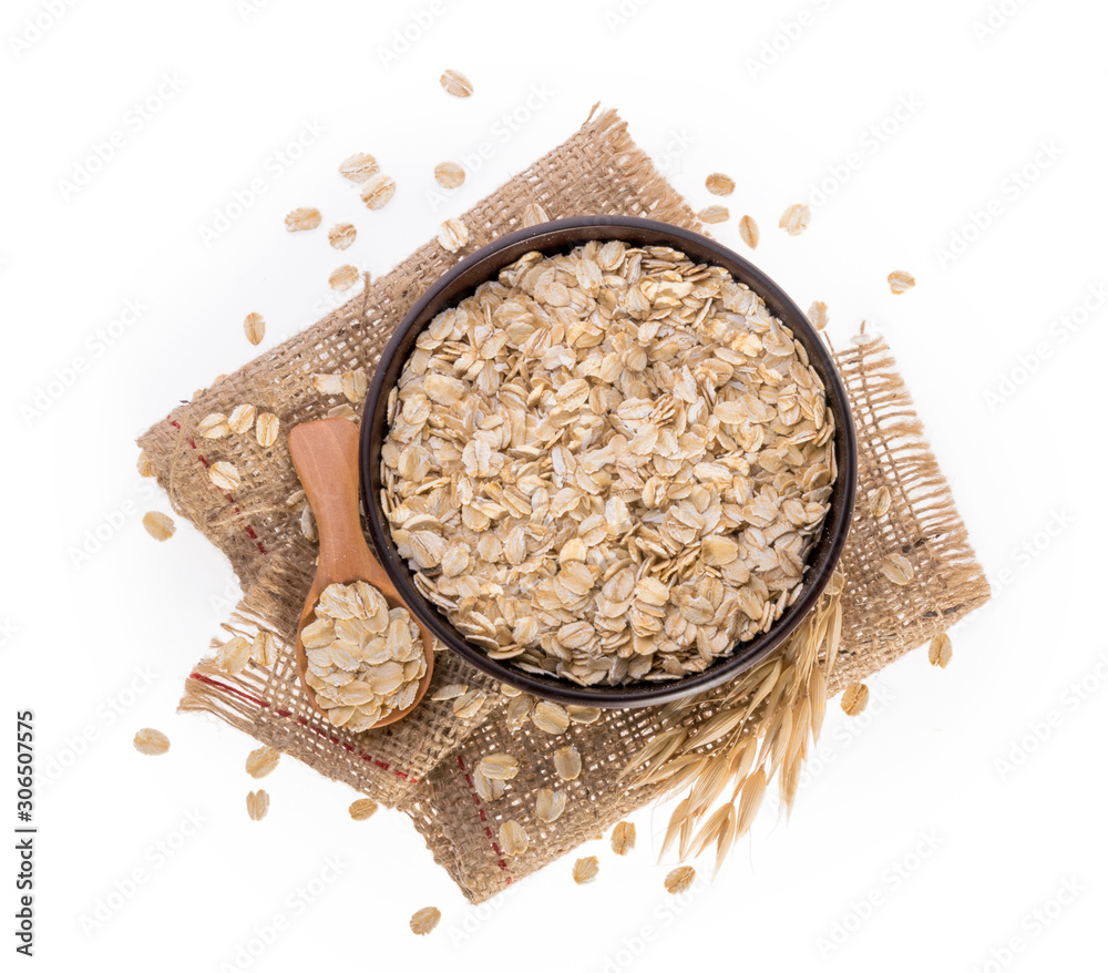 Rolled oats, healthy breakfast cereal oat flakes isolated on white top view