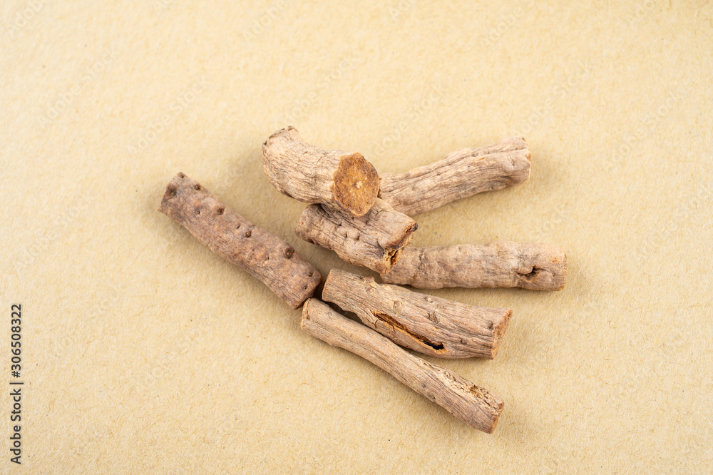 Fried Achyranthes bidentata with Chinese herbs on yellow paper