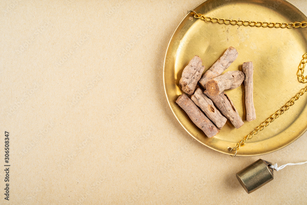 Fried Achyranthes bidentata with Chinese herbs on yellow paper