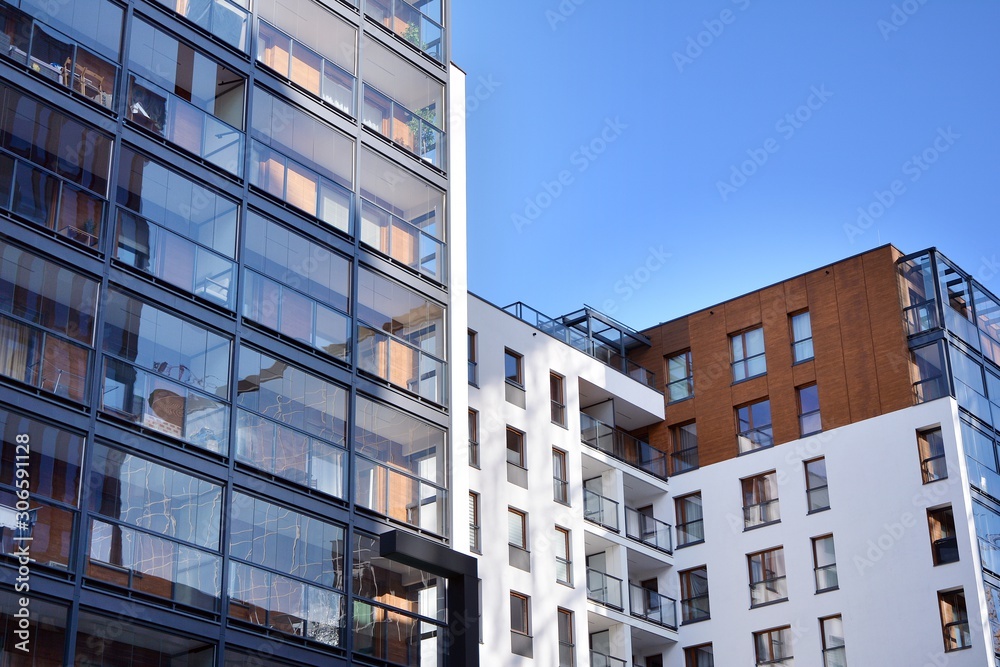 Fragment of modern residential apartment with flat buildings exterior. Detail of new luxury house an