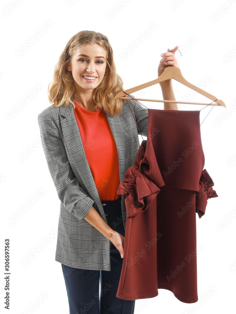 Female worker of modern dry-cleaner with clothes on white background