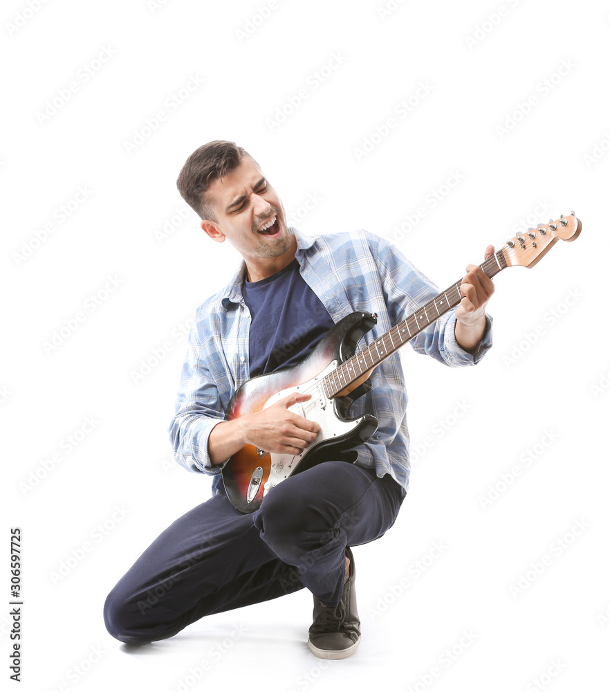 Handsome emotional man playing guitar on white background