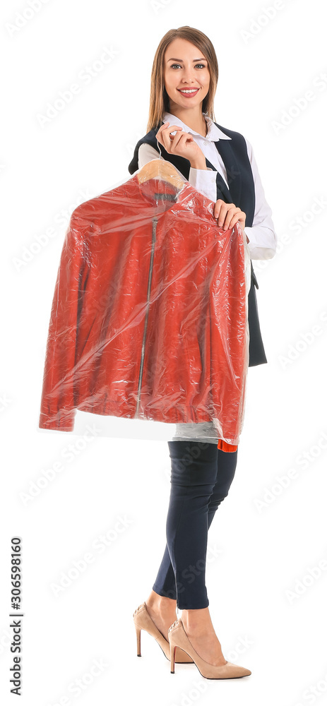 Female worker of modern dry-cleaners with clothes on white background