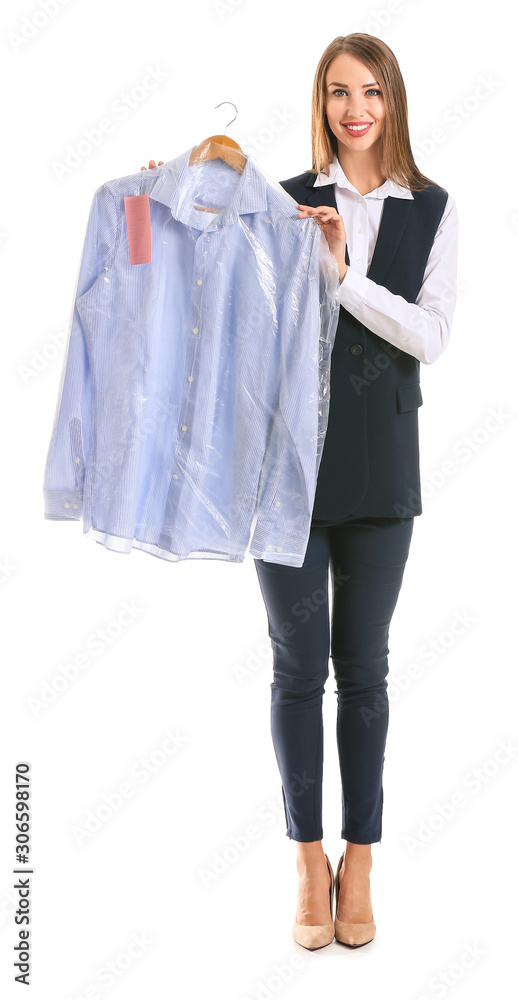 Female worker of modern dry-cleaners with clothes on white background