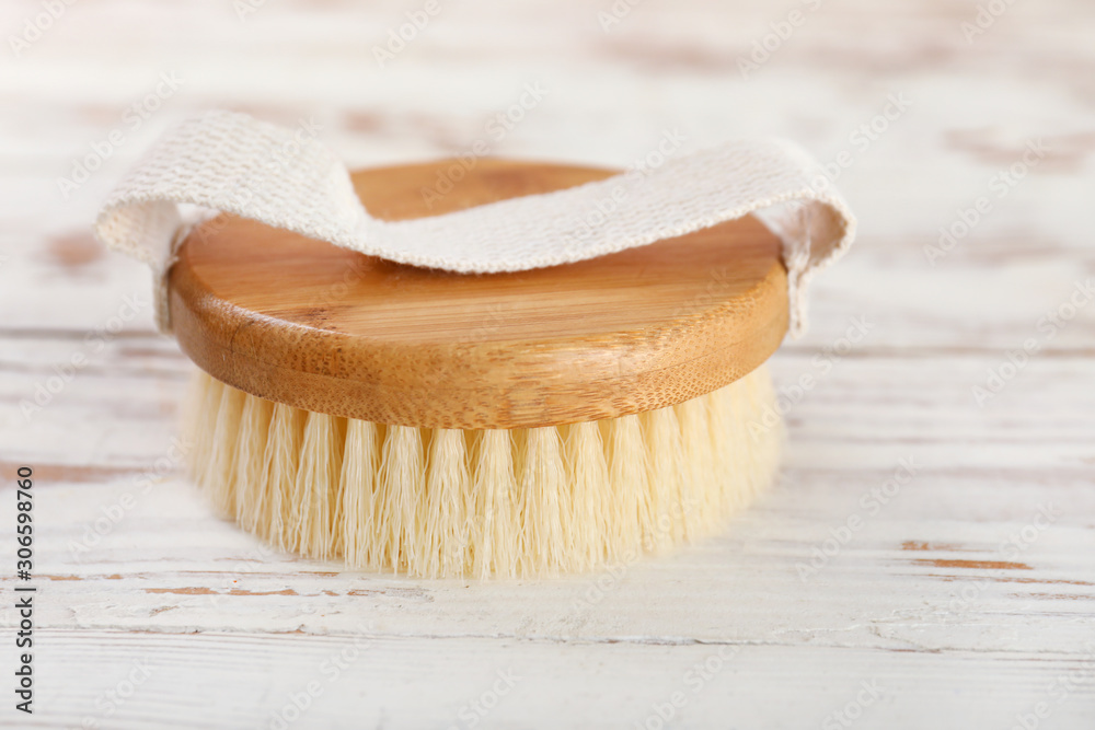 Brush for bath on wooden background