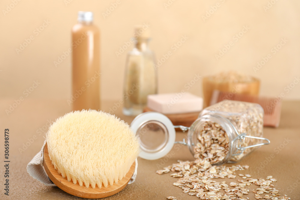 Brush for bath and oats on table